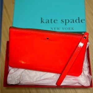 Kate Spade patent orange wristlet